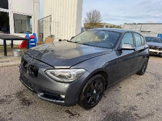 skadebil auto BMW 1-serie 116i Business AUTOMAAT 2011/11